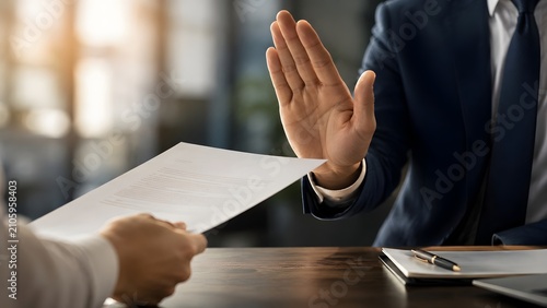 Businessman Making Stop Hand Gesture Rejecting Paper Contract and Refusing Deal During Office Meeting