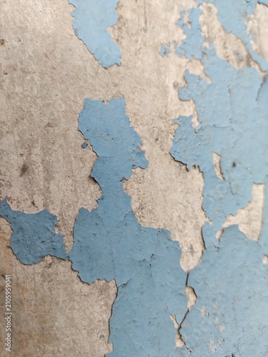 A distressed wooden surface featuring random peeling paint, chipped layers, cracks, scratches, and naturally weathered wood grain. The irregular worn texture creates a rustic, vintage, and aged appear