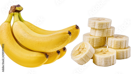 Isolated bunch of ripe yellow bananas and sliced peeled banana pieces for healthy snack