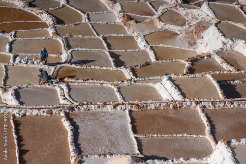 Traditional salt evaporation ponds at the Maras Salt Mines in the Sacred Valley of the Incas, Peru