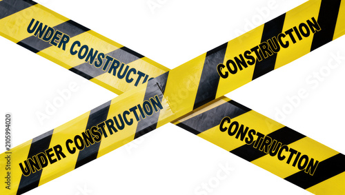 фотографія Isolated under construction yellow and black warning tape barrier crossing diago