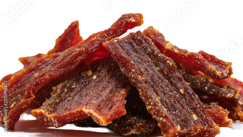 Obraz na płótnie Isolated pile of delicious spicy beef jerky strips, savory high-protein dried me