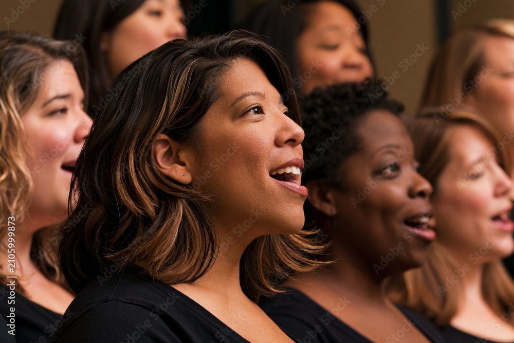 Fototapeta premium Inspiring Diverse Gospel Choir Harmonizing Joyfully on Stage, Exuding Spiritual Energy and Community Connection