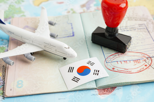 South Korea flag and passport with airplane for travel.