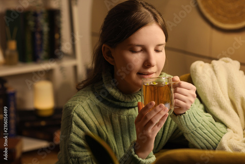 Young woman in a cozy green...