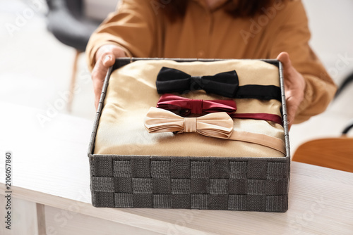 Female seller with box of s...