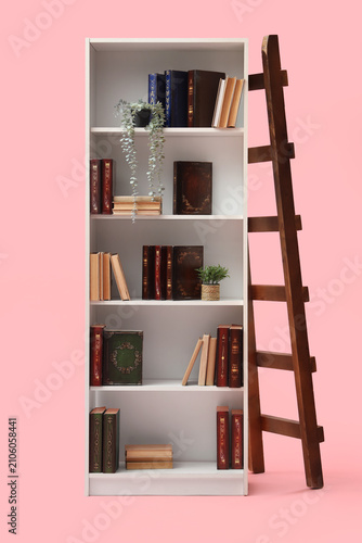 Bookshelf with many books, ...