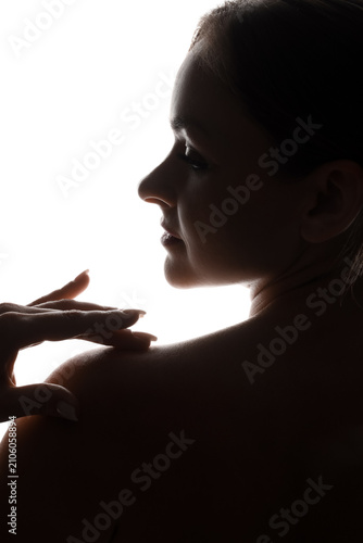 Silhouette of beautiful woman on white background, back view