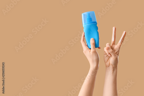 Woman with sunscreen cream ...