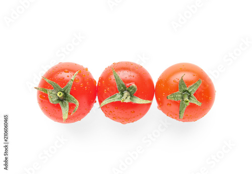 Fresh cherry tomatoes on wh...
