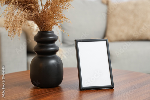 Coffee table with blank pho...