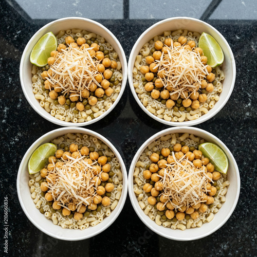 Four Bowls of Egyptian Koshari Traditional Street Food Rice Pasta Chickpeas Lentils Group Meal

