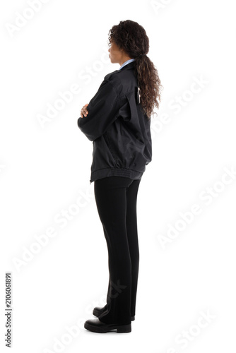 African-American female police officer on white background