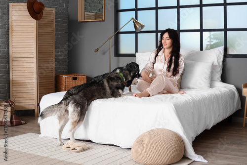 Young woman with cute dogs ...