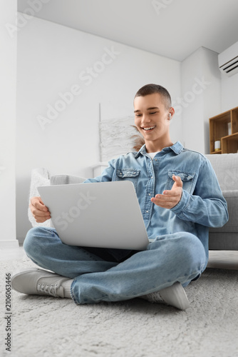 Young man with laptop video...