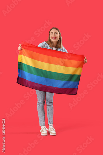 Young woman with LGBT flag ...
