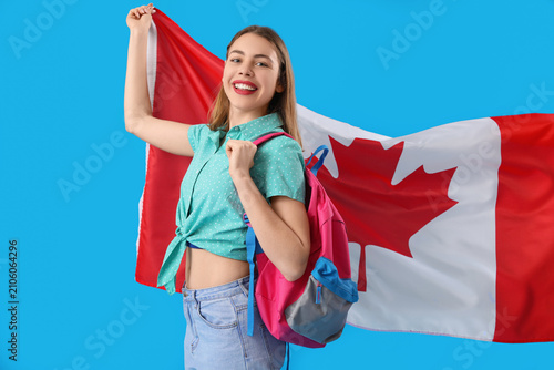 Female student with flag of Canada on blue background