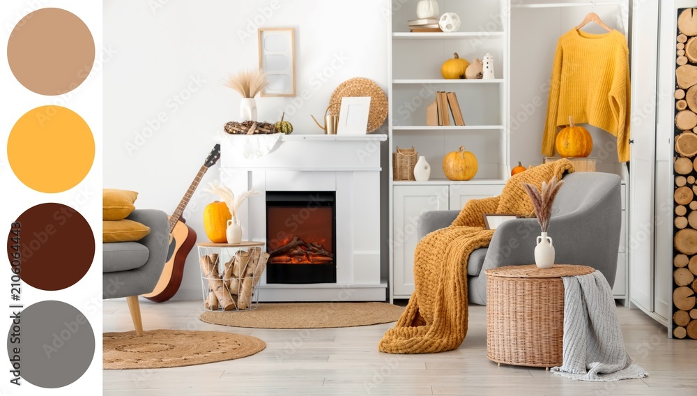 Obraz premium Cozy autumn living room interior with fireplace, pumpkins, and warm knitted blankets for seasonal comfort