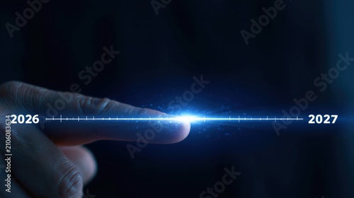 Finger touching digital light beam representing 2026 to 2027 future time line