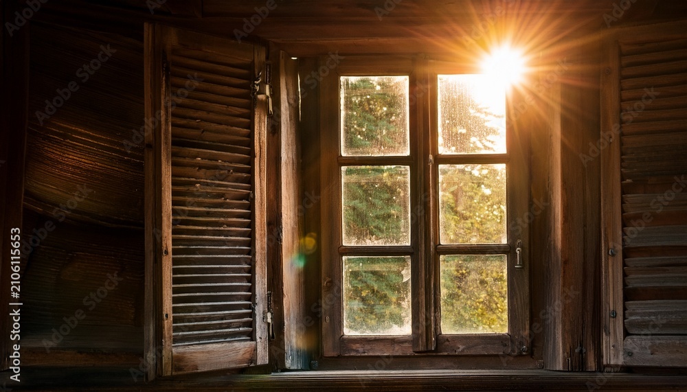 Fototapeta premium The Sunlight Shone Through The Worn Wooden Window
