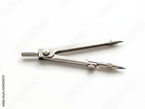 A metallic drafting compass used for geometry and technical drawing.