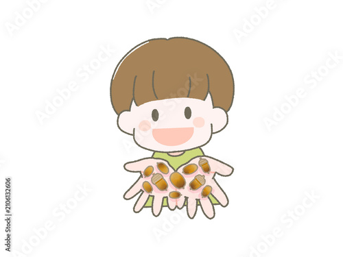 どんぐりをたくさん持った男の子