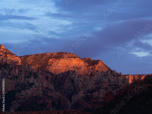 Obraz na płótnie Craggy mountains glow with sunset light