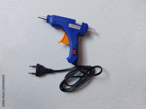 Foto Blue Electric Hot Glue Gun with Power Cord Isolated on White Background