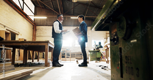 Obraz na płótnie Woodworking, workshop and inspector with foreman with tablet, conversation and clipboard for inspection