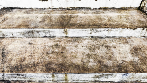 Weathered Concrete Steps: An aerial view showcases old, worn concrete steps with accumulated dirt and streaks of moss, hinting at the passage of time and weather.