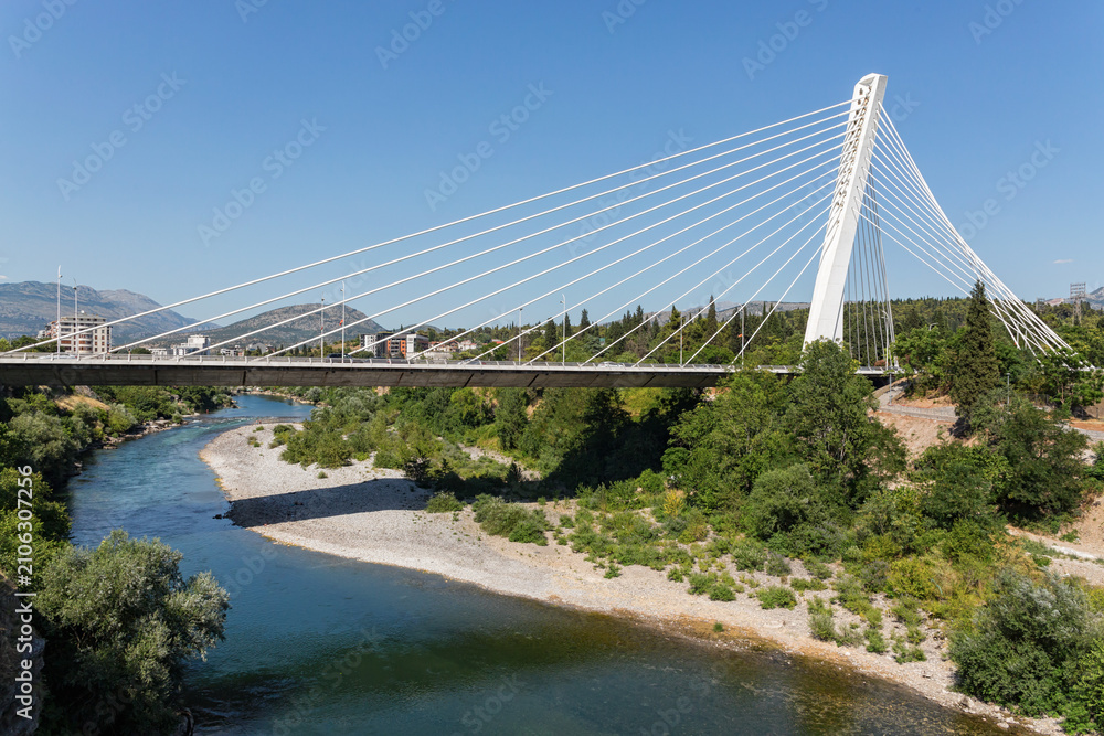Fototapeta premium Millennium Bridge over Moraca River in Podgorica, Montenegro with scenic summer landscape