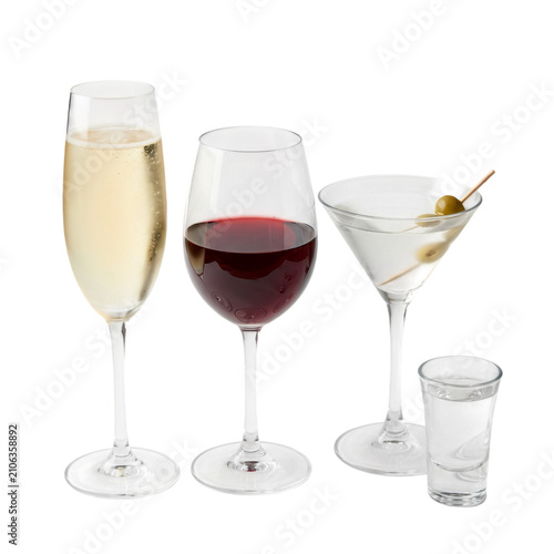 Elegant assortment of classic cocktail drinks on white background. Three iconic alcoholic beverages with clear glassware and garnishes displayed.