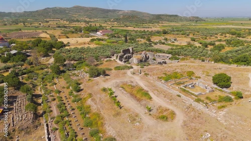 Balat, Turkey. Baths of Faustina, monumental Roman thermal complex with vaulted stone ruins and palaestra, aerial drone view under clear summer sky. Aerial View, Point of interest