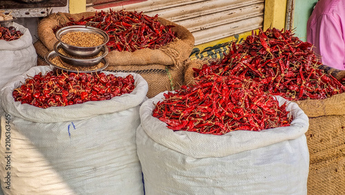 Bild auf Leinwand Large sacks filled with dried red chilies displayed for sale at a traditional In