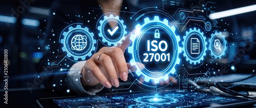 Businesswoman interacting with digital interface displaying iso 27001 certification showcasing cybersecurity and data protection concepts in a modern office environment