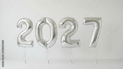 Silver metallic balloons forming a future calendar year date