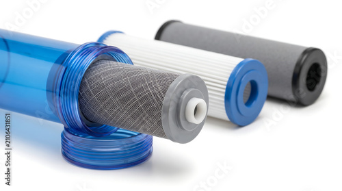 Water filtration cartridges isolated on white background for purification with cartridges lying displays water industrial technology horizontal