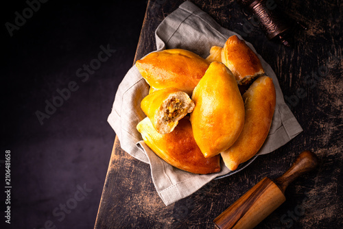 Fényképezés Traditional baked pies pirozhki with meat.