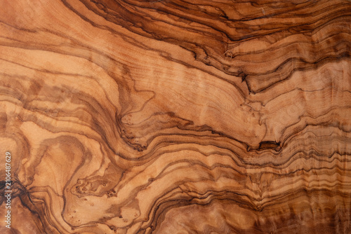 Texture of a wooden board of olive tree using as header or background, natural surface