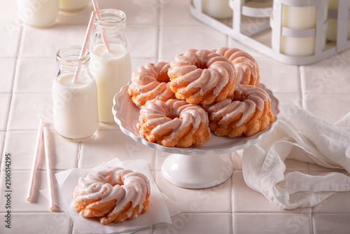 Obraz na płótnie Homemade and delicious spanish donuts with white sugar glaze.