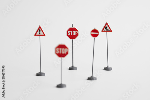 Miniature Road Traffic Signs Isolated on White Background