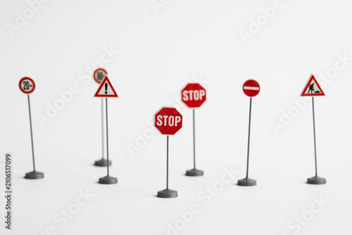 Miniature Road Traffic Signs Isolated on White Background