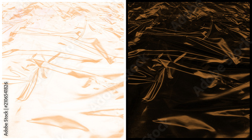 Crumpled metallic foil texture, shiny copper and bronze plastic wrap background, abstract wrinkled surface with reflective highlights