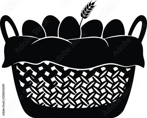 Black silhouette of a basket filled with eggs and a wheat stalk