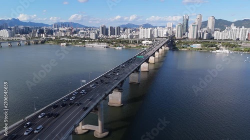 Aerial Drone Flight Toward Cheongdam Bridge Across Han River with Seoul Skyline in South Korea