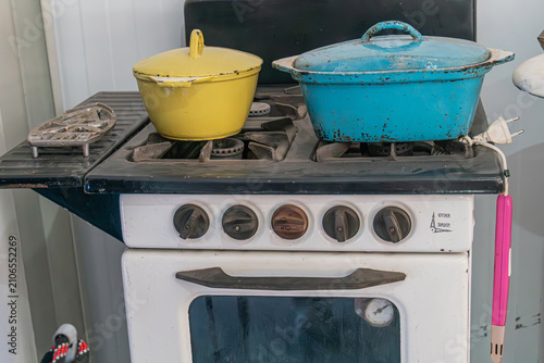 Cuadro en lienzo Vintage gas stove featuring five control knobs, dark greenish-blue top surface,
