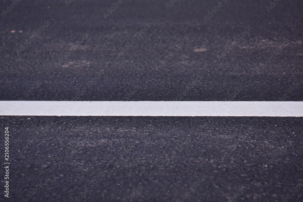Fototapeta premium black asphalt road and white dividing lines, Asphaltic concrete road with yellow and white traffic lines, asphalt, road, surface, traffic, street, transportation, black, white, background, highway, li