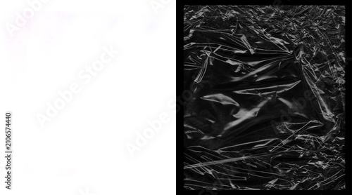Quadro su tela Crumpled black plastic wrap texture, wrinkled polyethylene film background, shin