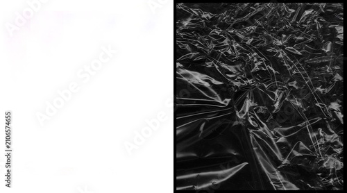 Quadro su tela Crumpled black plastic texture, wrinkled polyethylene film background, dark glos