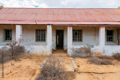 Abandoned, derelict old colonial farmstead in arid region